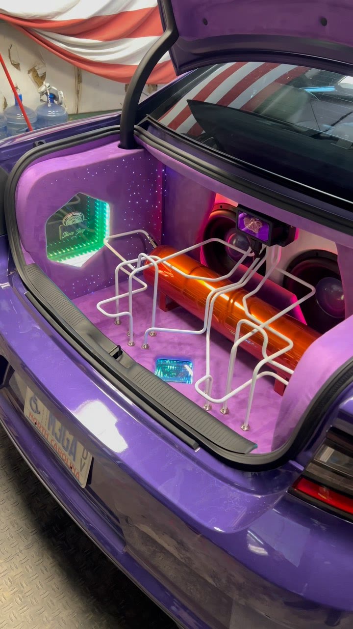 Show-trunk setup with purple LED lighting and polished hardlines.