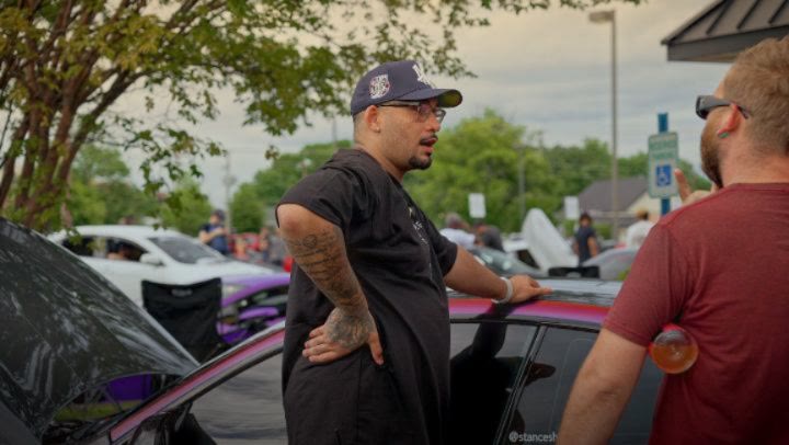 Slammed builds lined up at a Carolina Stance Shop meet.
